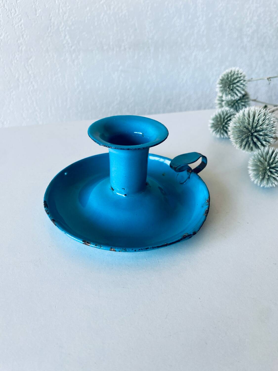 Antique enamelled metal candle holder