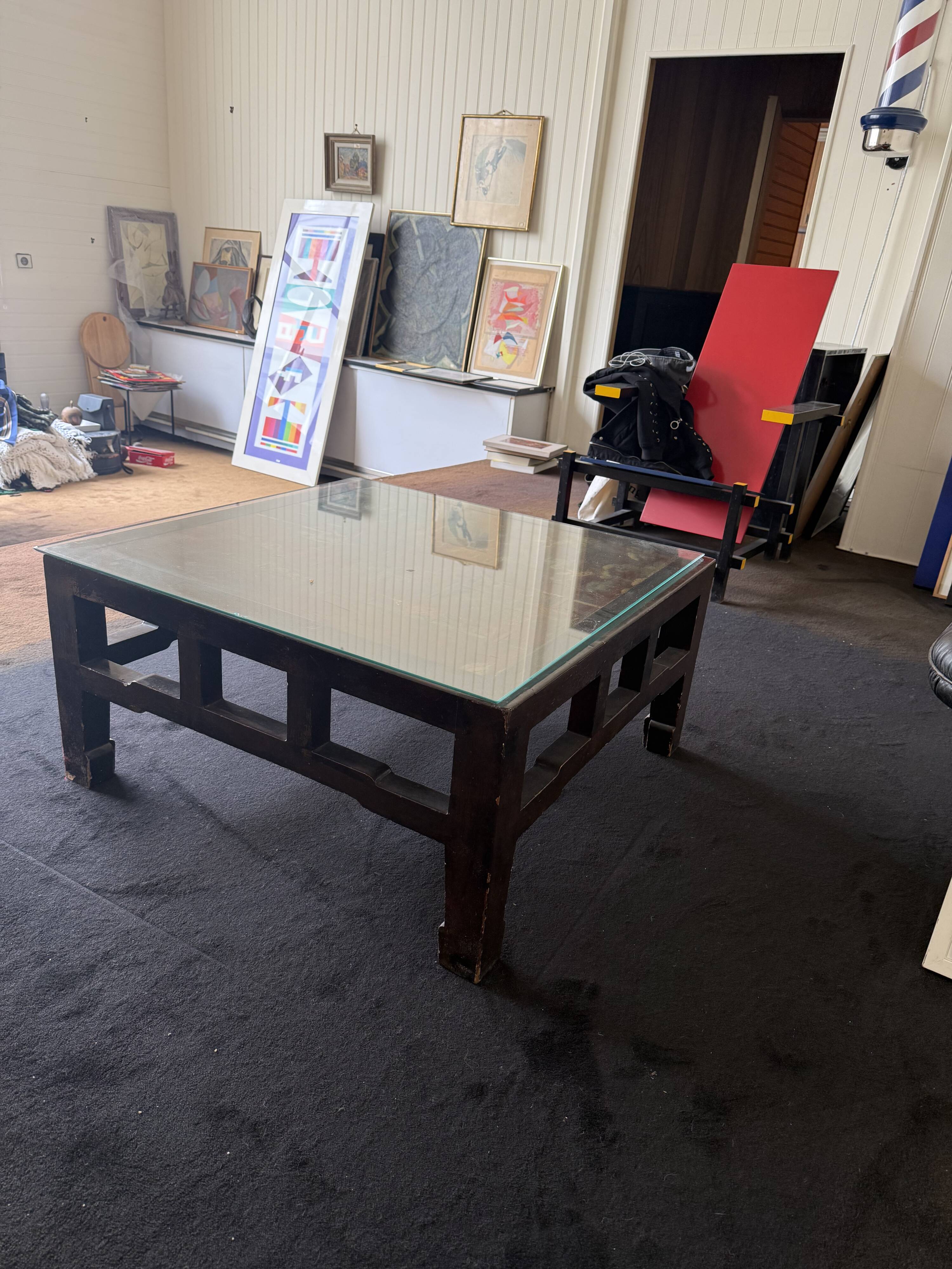 Vintage brutalist coffee table with Asian decor.