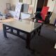 Vintage brutalist coffee table with Asian decor.