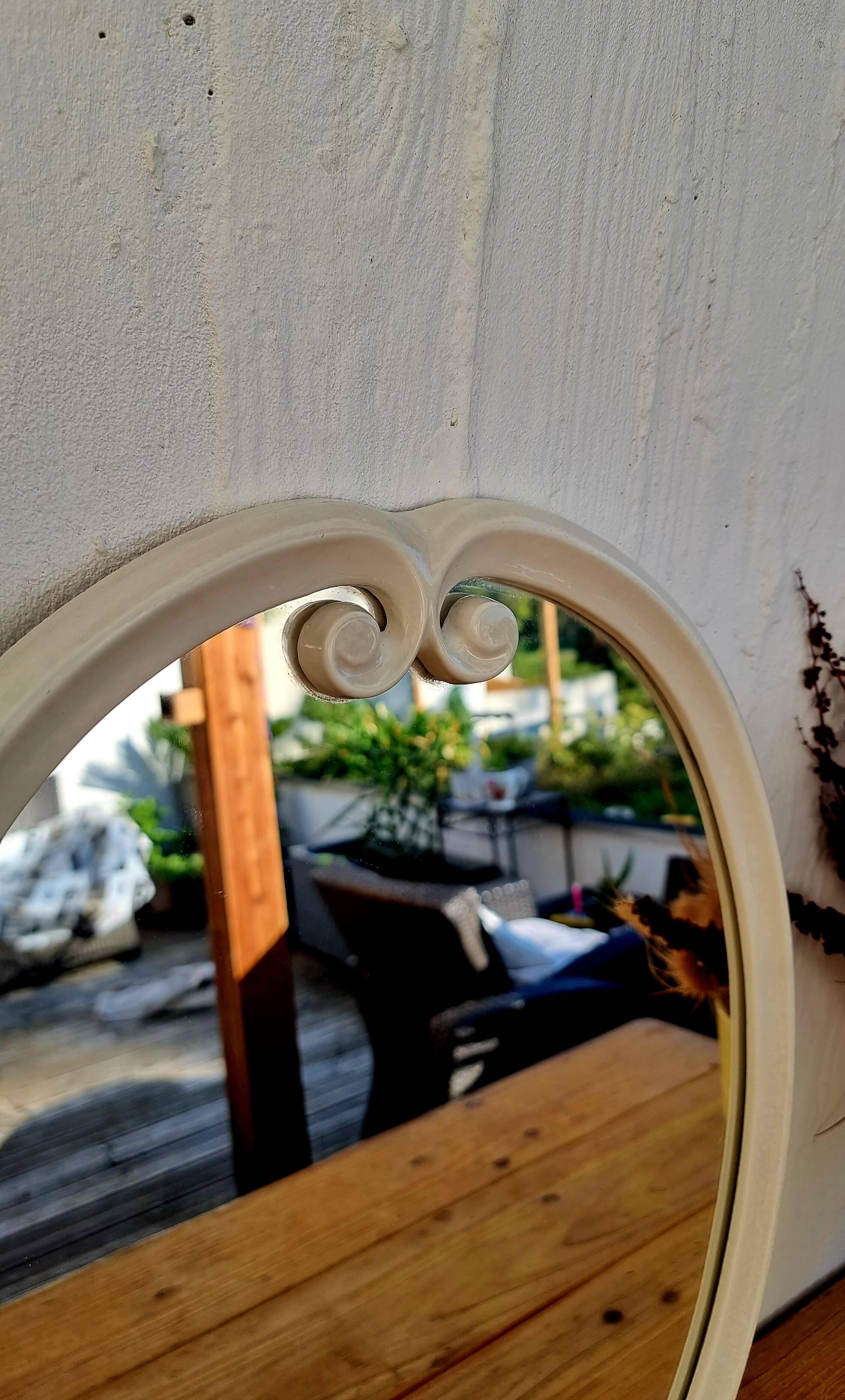 Vintage enamelled metal oval mirror