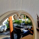 Vintage enamelled metal oval mirror