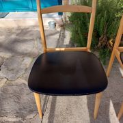 3 Scandinavian style chairs, light wood and black faux leather.