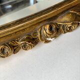 Vintage carved and gilded oval wall mirror