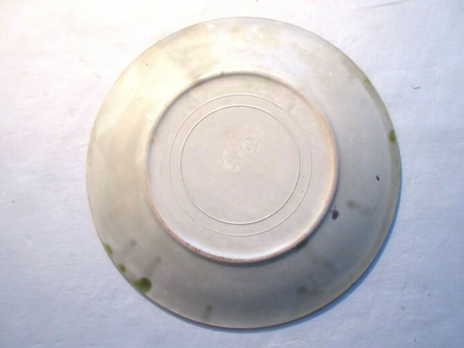 Dabbling plate with trompe l'oeil fish, signed sp,