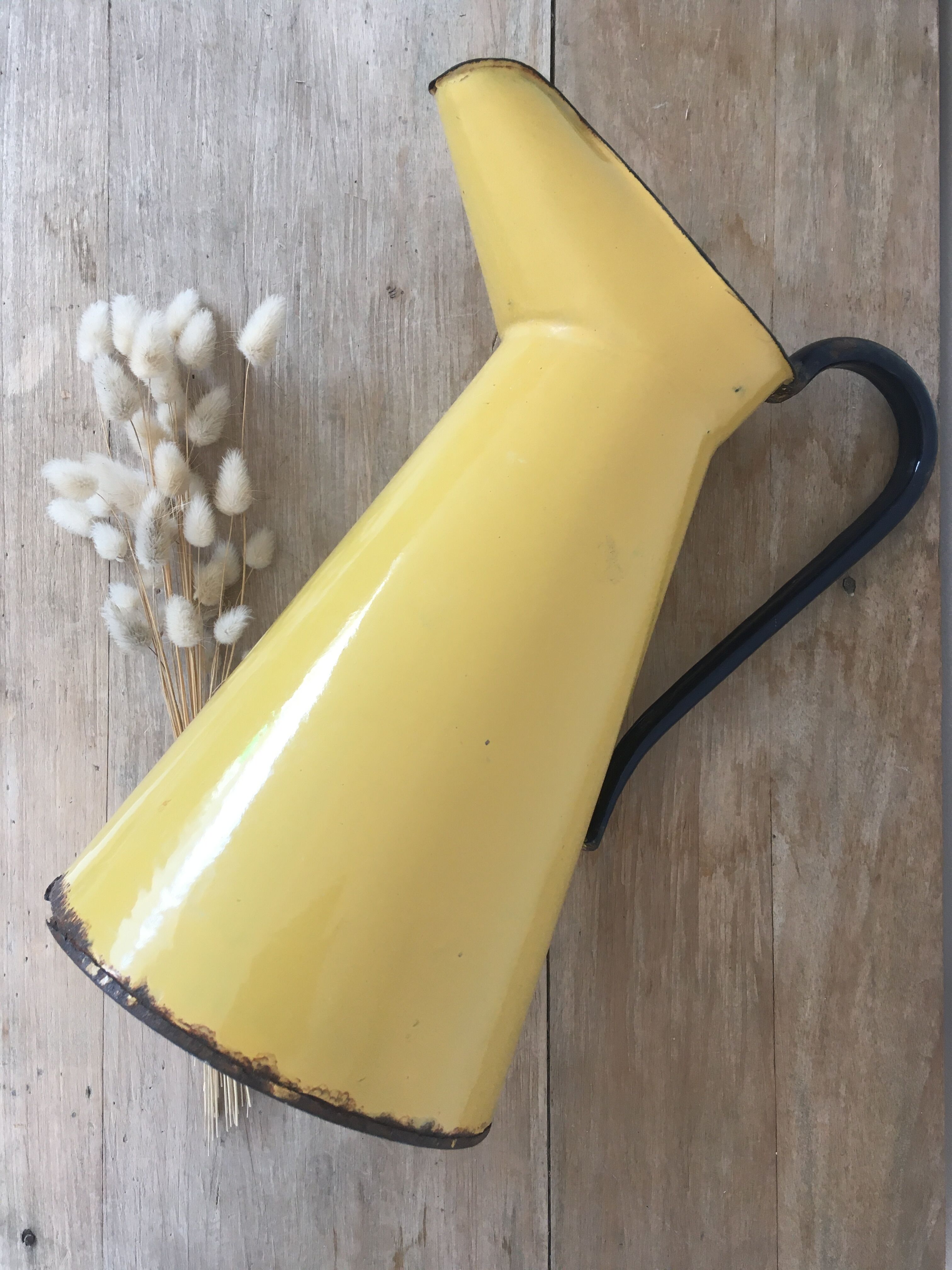 Mustard yellow enamelled sheet metal pitcher