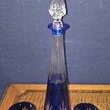 Cobalt blue double crystal service, consisting of a decanter and two matching glasses.