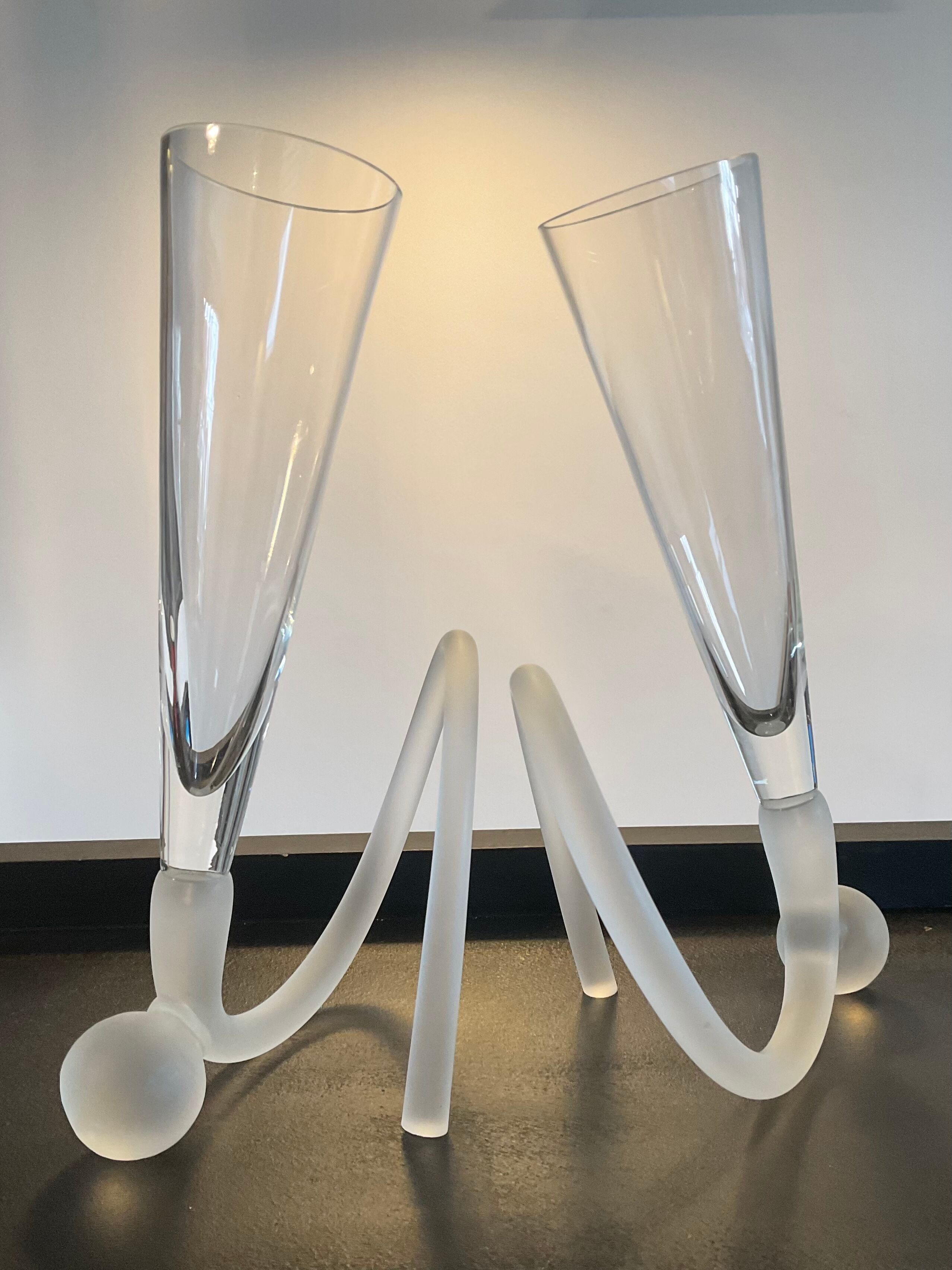 Pair of champagne glasses signed in glass paste