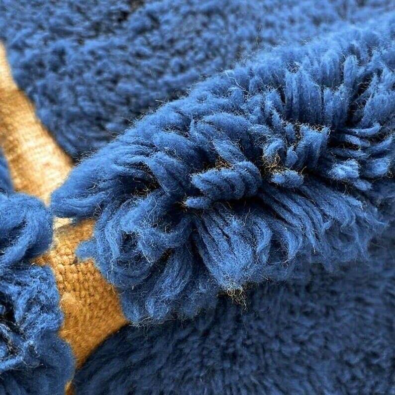 Handmade traditional pure wool carpet with blue patterns.