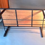 Vintage modernist coffee table in teak and black metal.