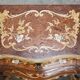 Pair of curved walnut commodes with marquetry and marble tops.