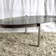 Table basse de forme élyptique en metal chomé et verre fumé, années 70
