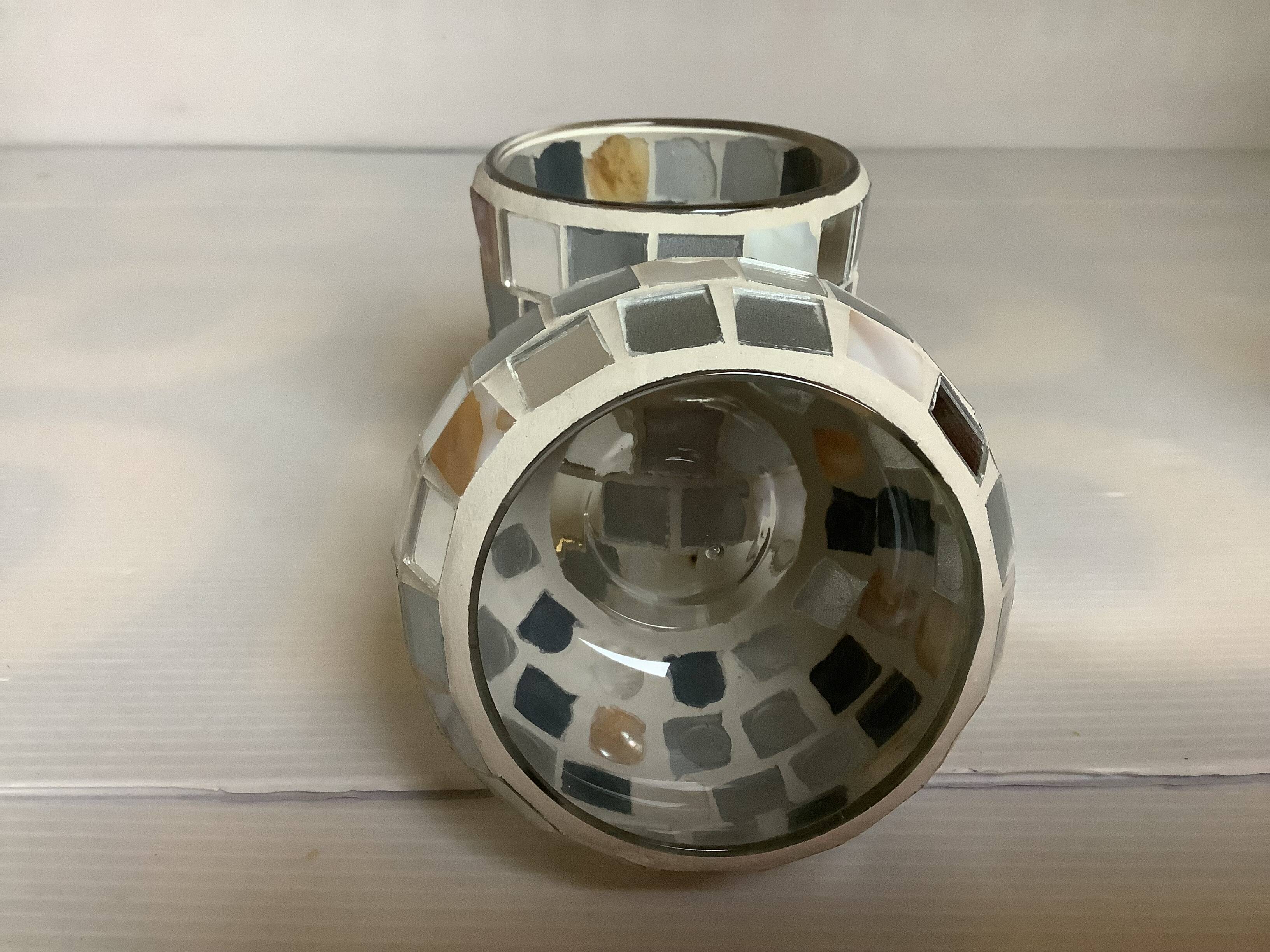 Four mosaic mirror and mother-of-pearl candle holders.