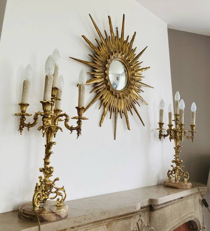 Pair of gilt bronze chandeliers, marble bases.