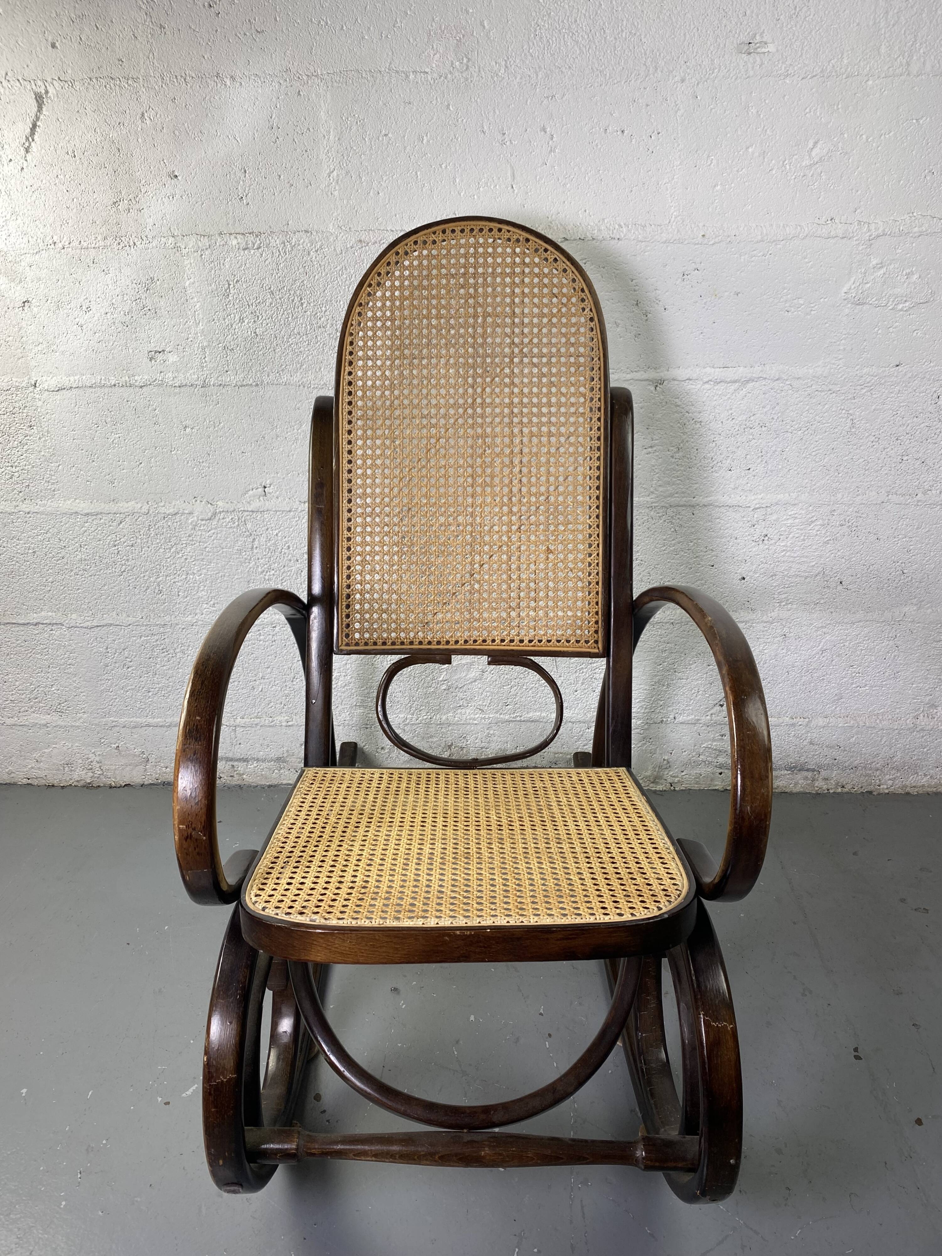 Rocking chair Chair in wood and Cannage from the 70s