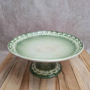 Antique compote stand Lunéville St Clément with green clover decoration.
