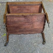 Extendable wooden bar trolley with a glass top from the 1930s.