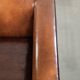 Sleek sheepskin Art Deco design armchair with black piping