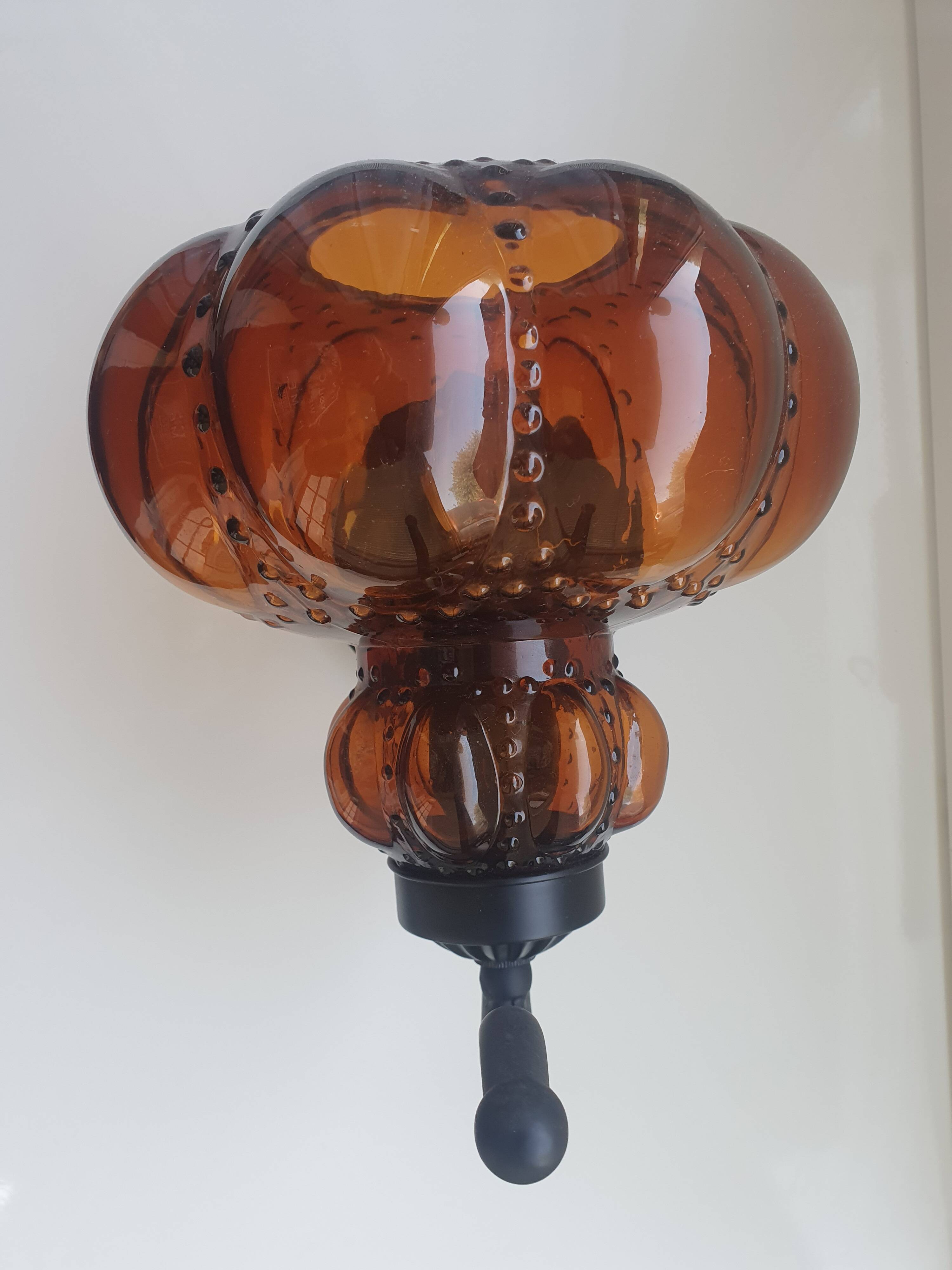 Three large vintage brown glass wall lights