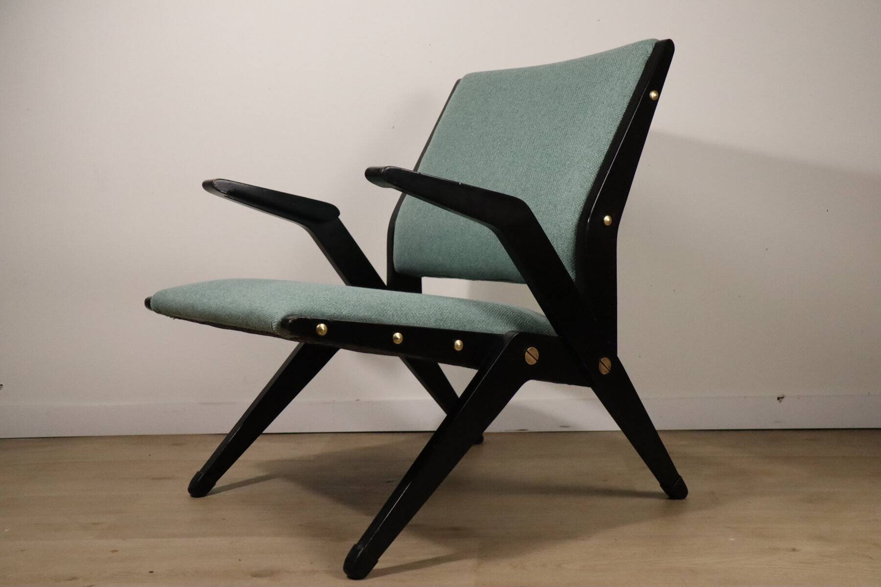 Vintage armchair from the 1960s in black wood and fabric.
