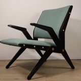Vintage armchair from the 1960s in black wood and fabric.
