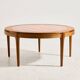 Coffee table in walnut with a ceramic top.