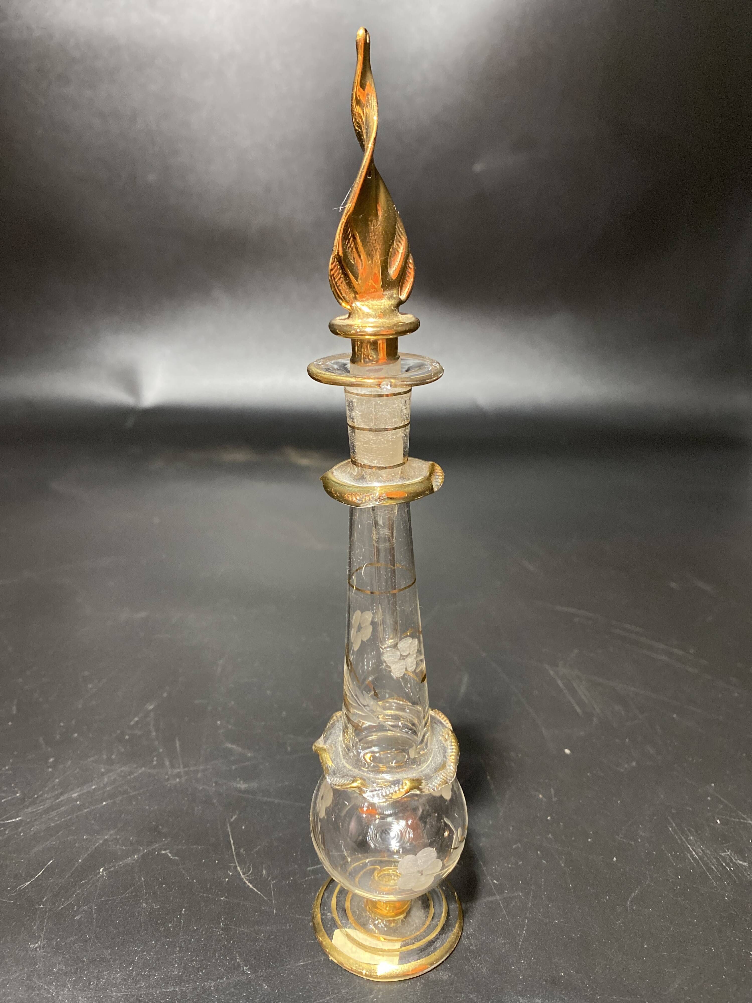 Set of 8 blown glass perfume bottles gilded with 12 carat gold