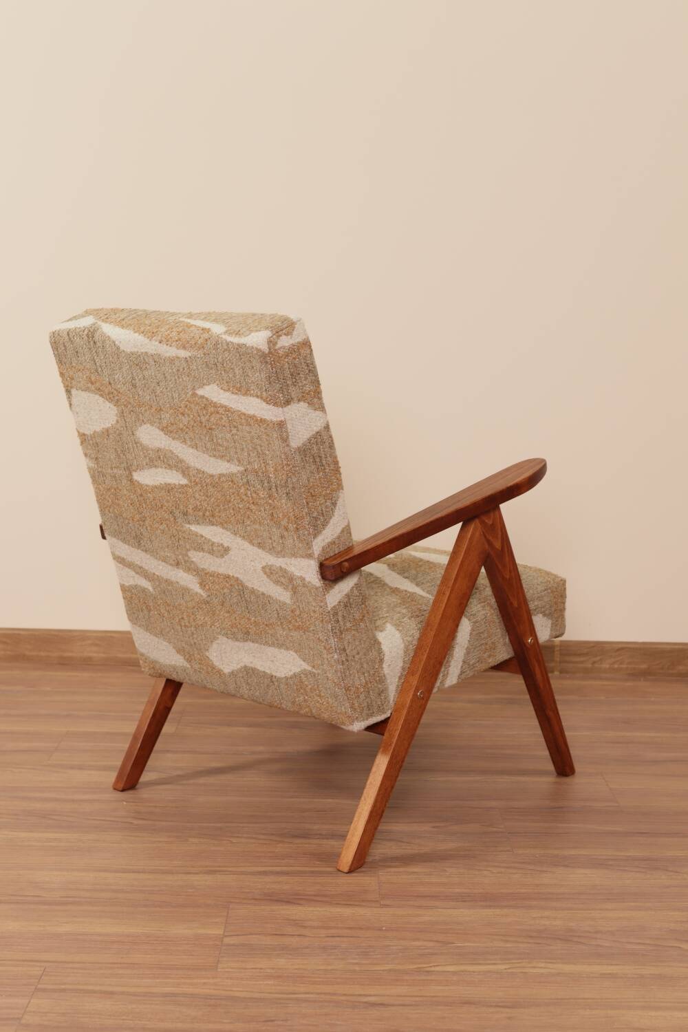 Pair of vintage lounge chairs in brown jacquard fabric and wood.