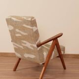 Pair of vintage lounge chairs in brown jacquard fabric and wood.