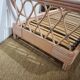 Pink rattan bed and bedside table set