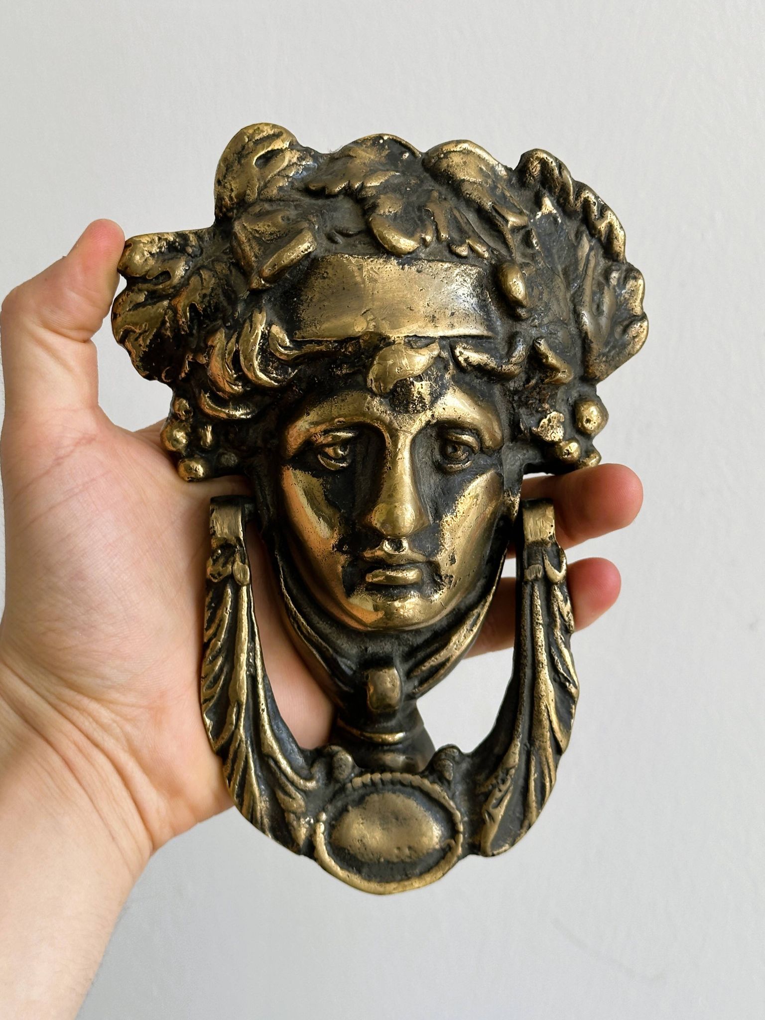 Large antique style brass metal knocker.