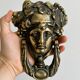 Large antique style brass metal knocker.