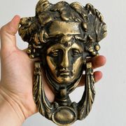 Large antique style brass metal knocker.