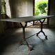 Old bistro table – cast iron legs and natural slate top