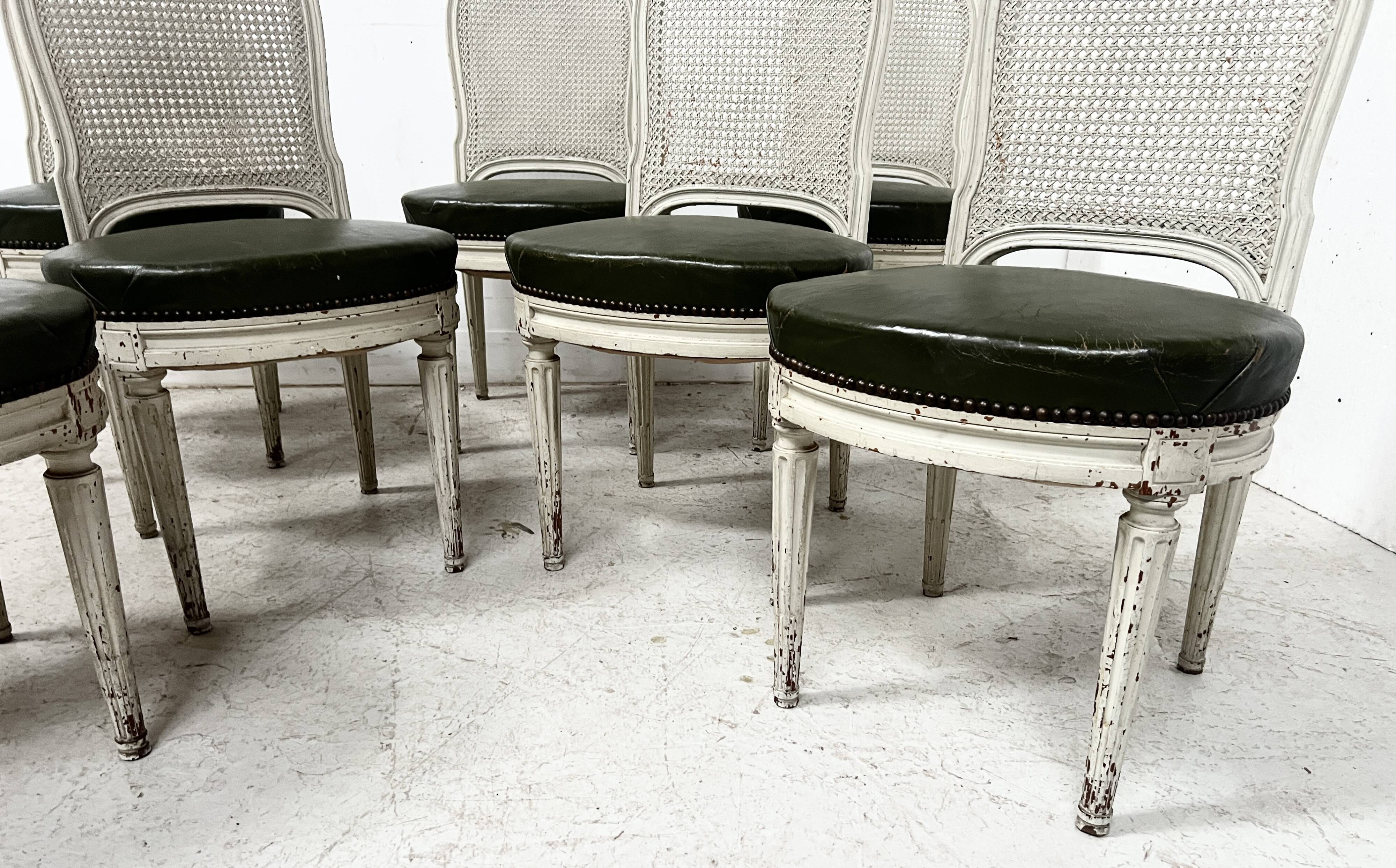 Set of seven Louis XVI style chairs in patinated beech, 20th century.