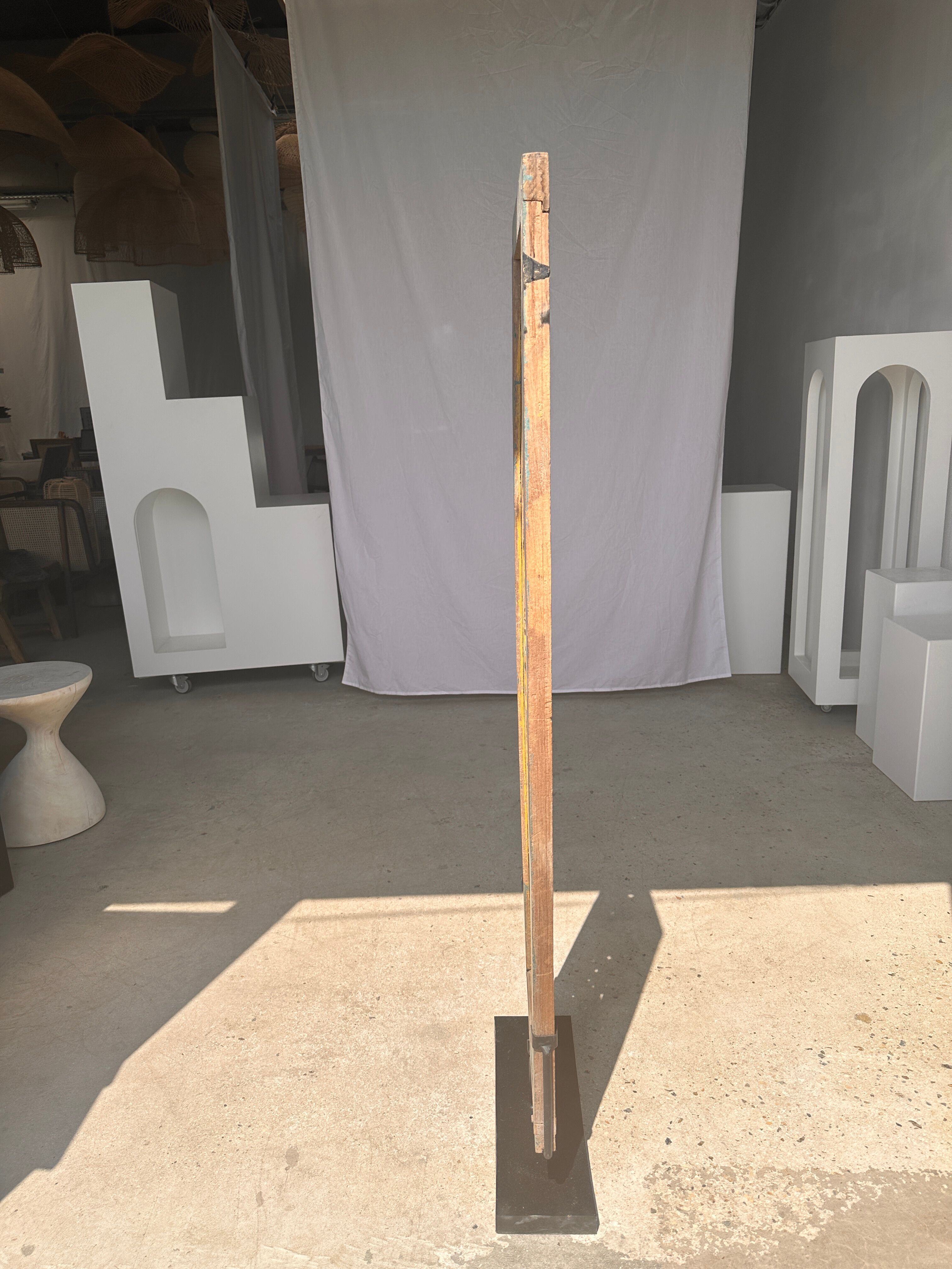 Rectangular Indonesian construction element with blue and yellow plant in carved wood