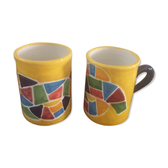 Glazed pottery mugs.