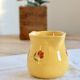 Vintage yellow ceramic milk jug – Hand-painted floral pattern