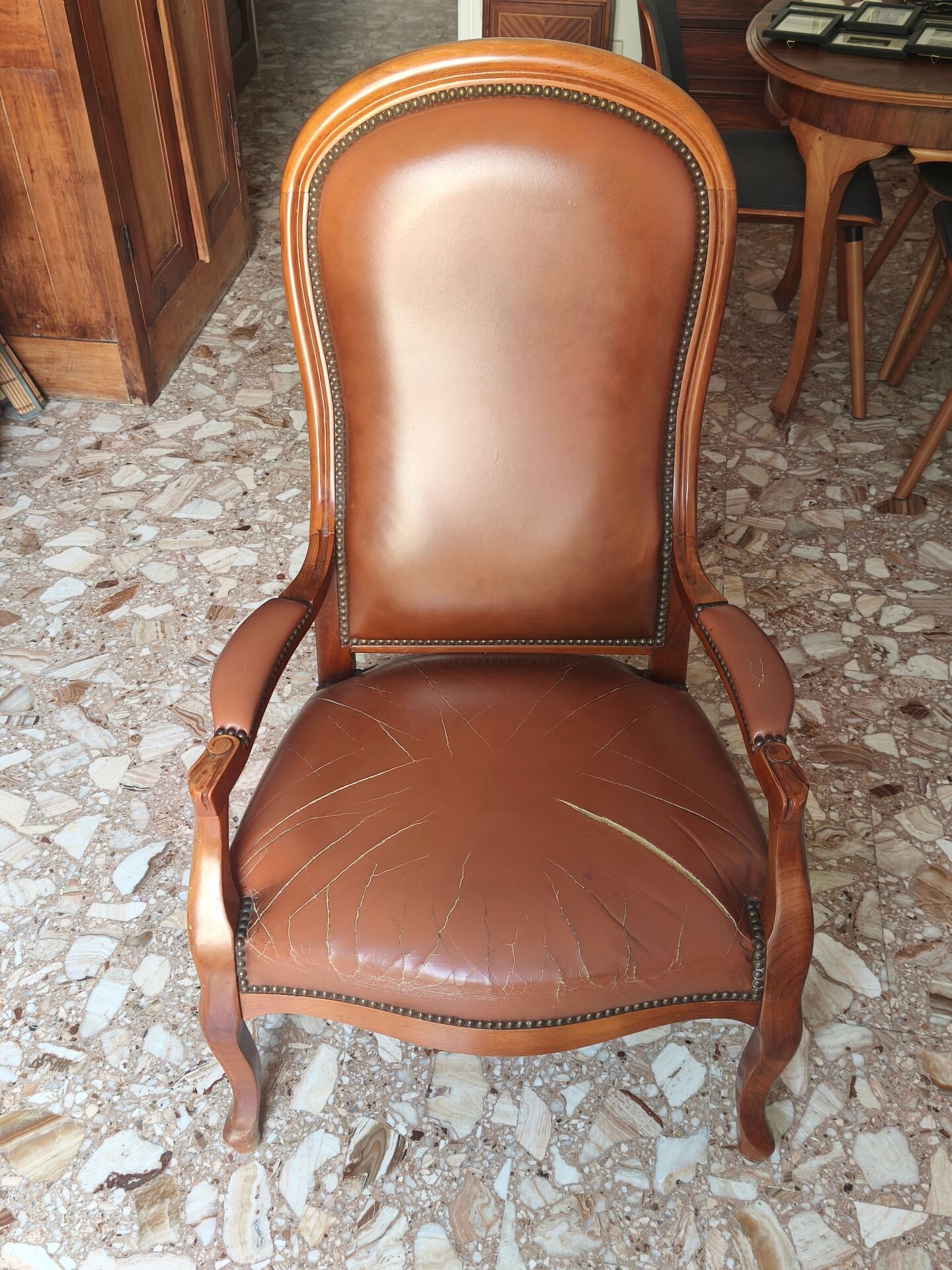 Leather armchair signed