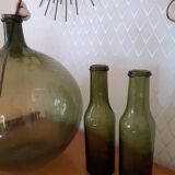 Pair of green bottles made of bubbled blown glass