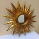 Sun mirror in carved gilded wood from the 1950s