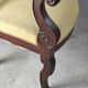 2 antique matching armchairs in wood and fabric