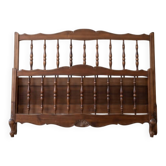 Double bed frame in antique Louis XV style made of solid wood.