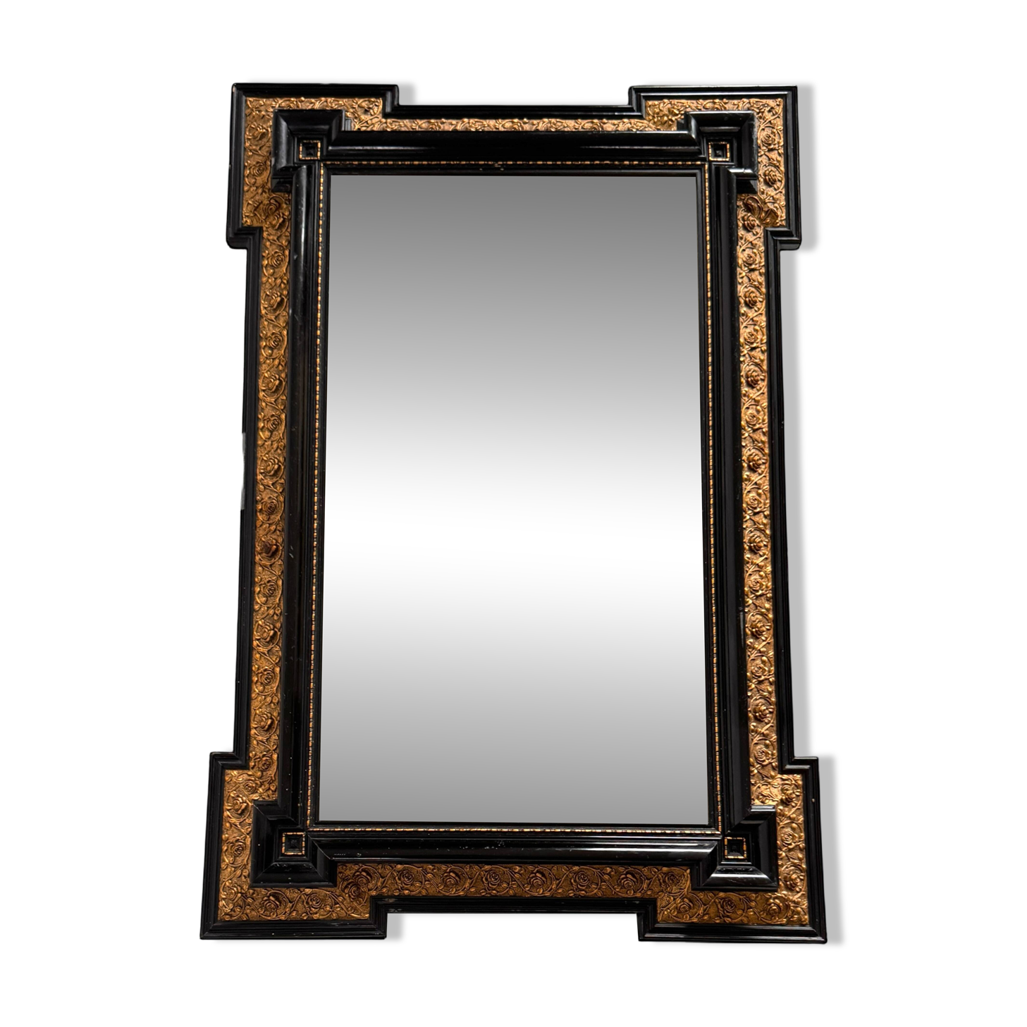Antique wall mirror in blackened wood and gilded stucco, 19th-century Dutch style.