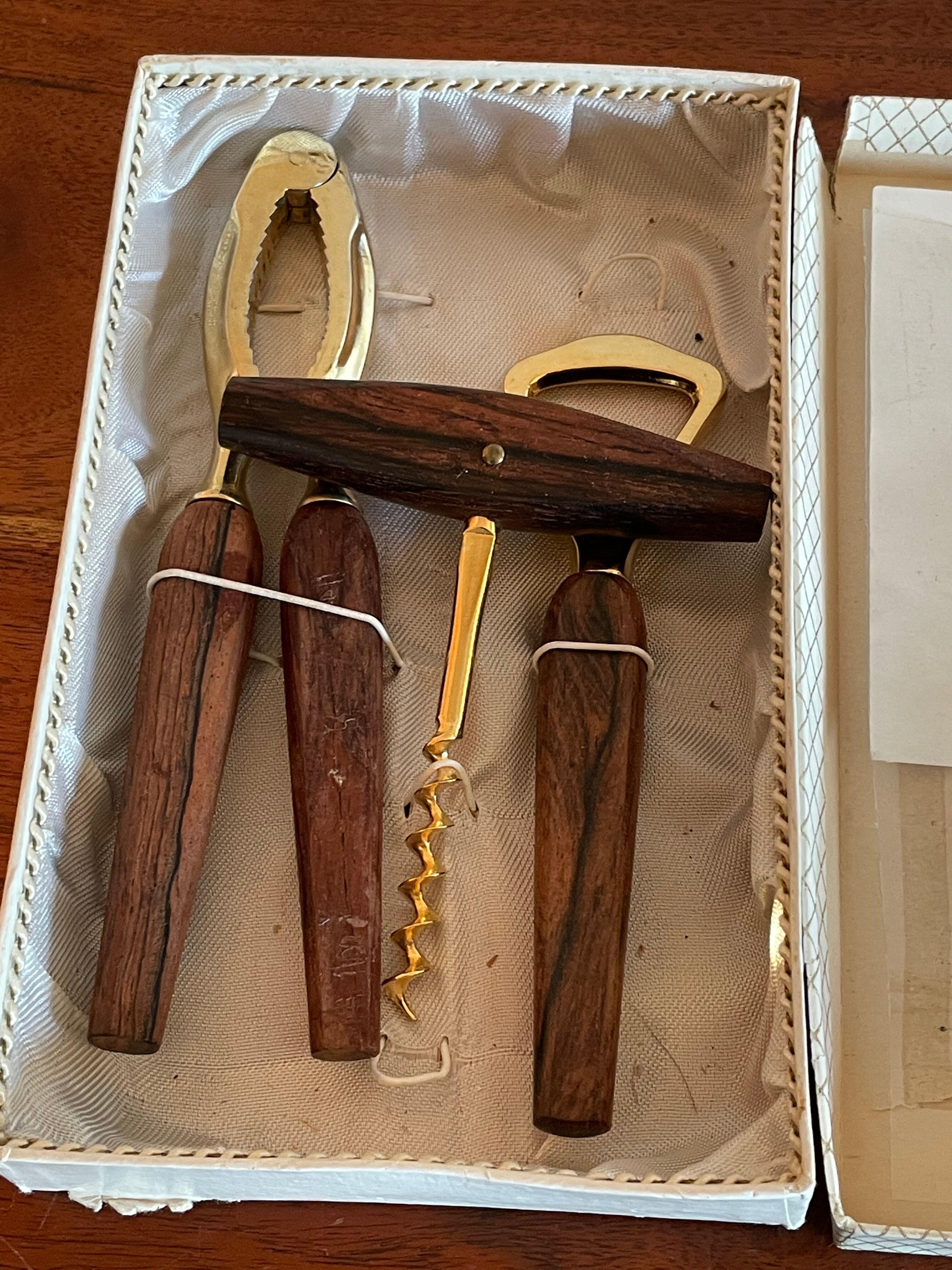 Bottle opener made of teak wood, corkscrew and nutcracker