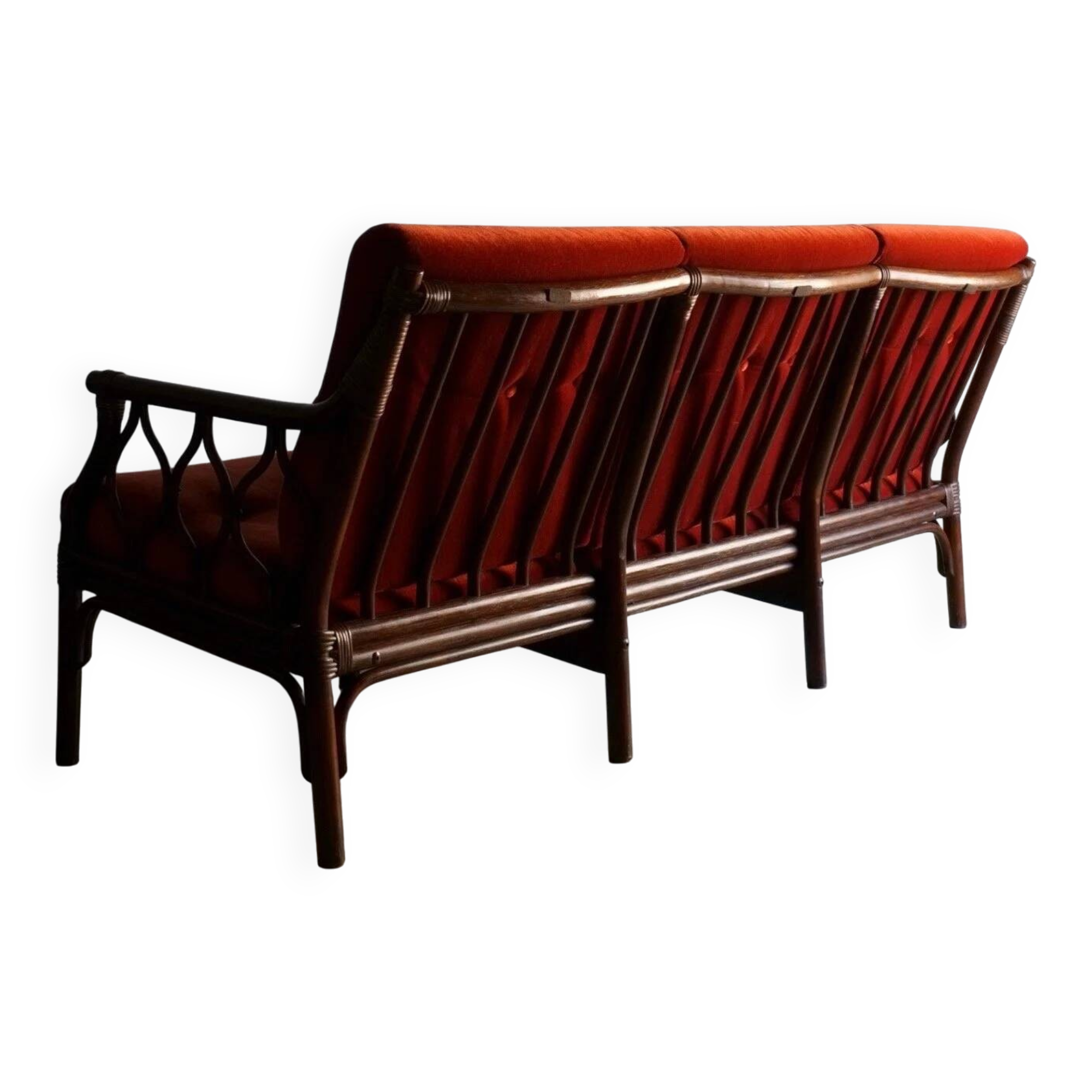 Dark rattan 3-seater sofa with red velour cushions | 1980s