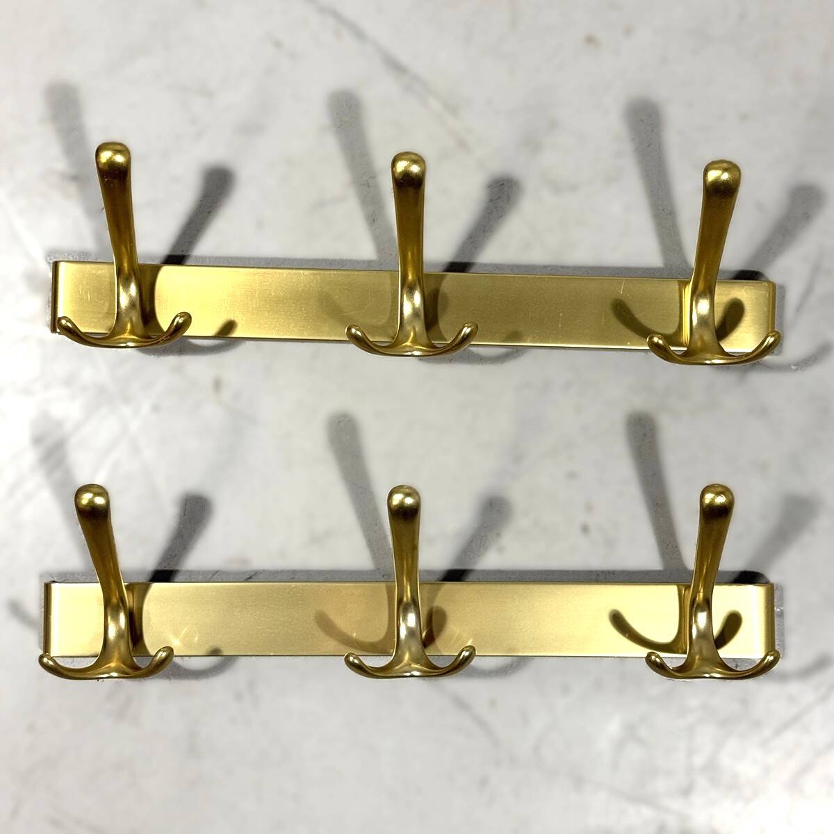 Gold coloured aluminium wall coat racks 1960’s