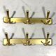Gold coloured aluminium wall coat racks 1960’s