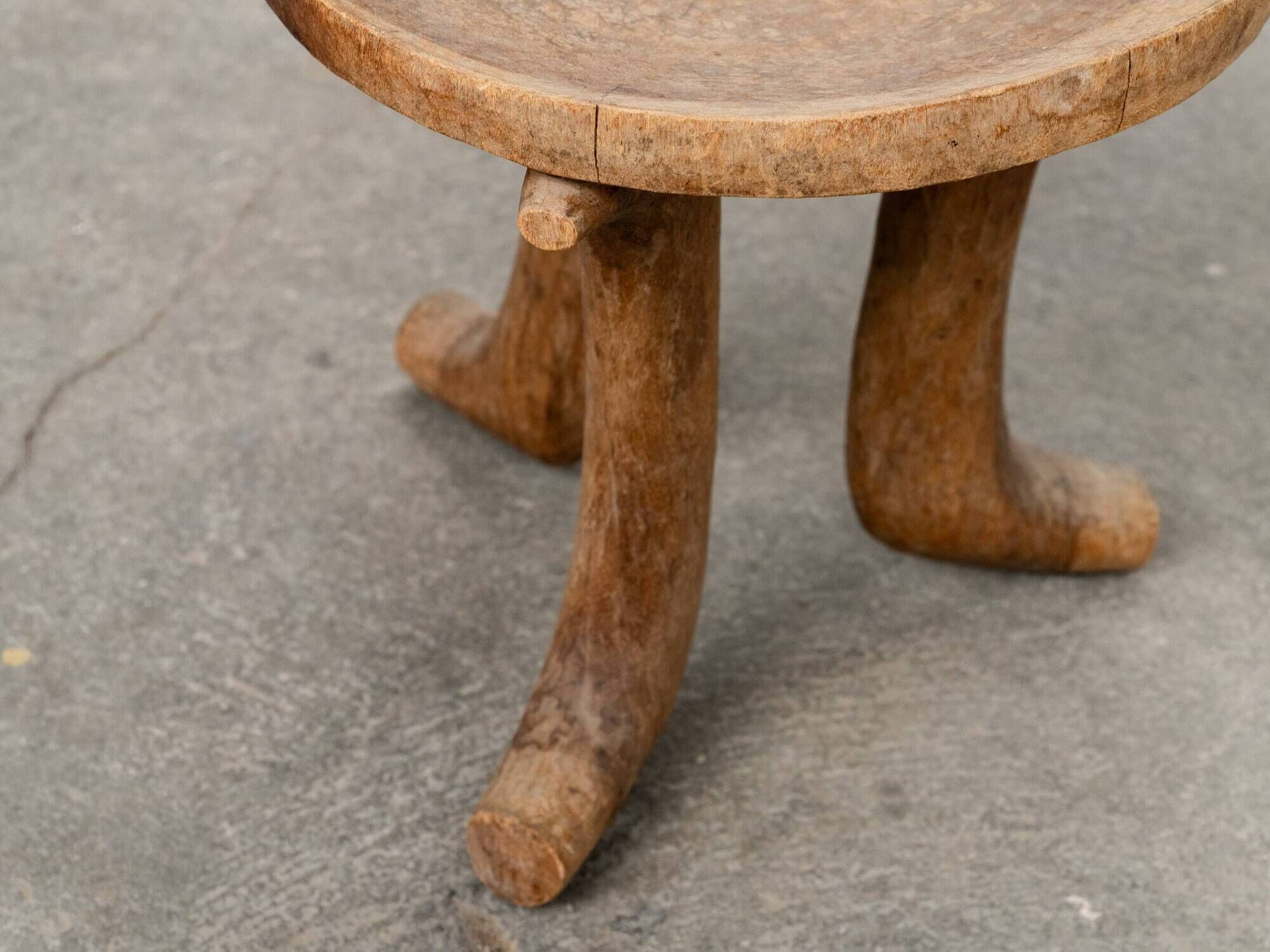 Ancient primitive monoxyle tripod stool from Ethiopia, Wanza wood.