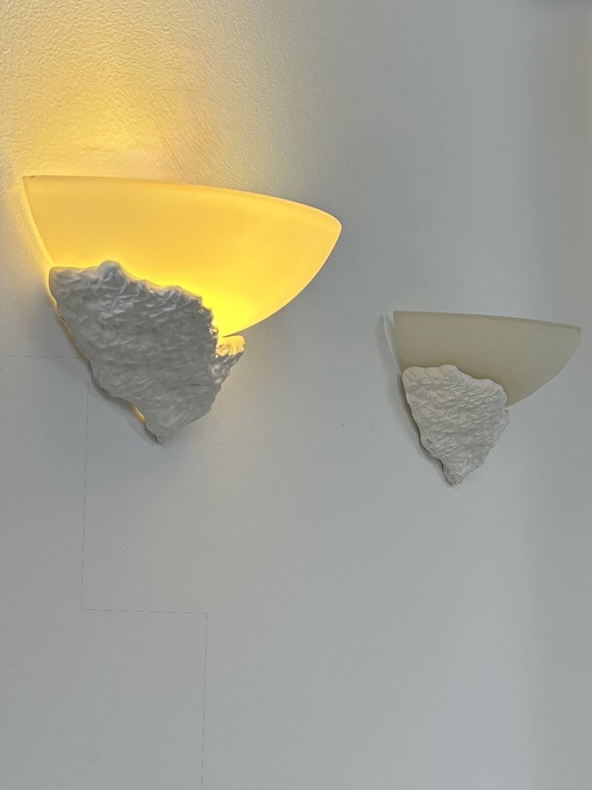 Pair of plaster and frosted glass wall lights, France, 1970.