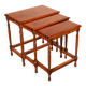 Nested tables in satin wood with brass inlays.